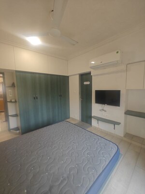 Bedroom in 2.5 BHK Apartment at NRI Complex Phase I, Seawoods Sector 58 – for Rent