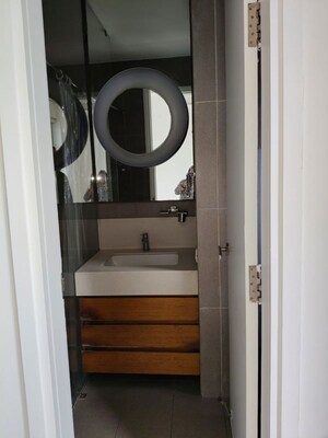 Bathroom in 3 BHK Apartment at Ambience Island Lagoon, Sector 24 – for Rent