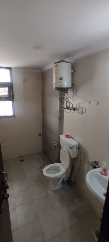 Bathroom in 3 BHK Apartment at Ambience Island Lagoon, Sector 24 – for Rent