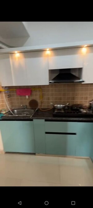 Kitchen in 2 BHK Apartment at Mahagun Mywoods, Sector 16c Greater Noida – for Rent