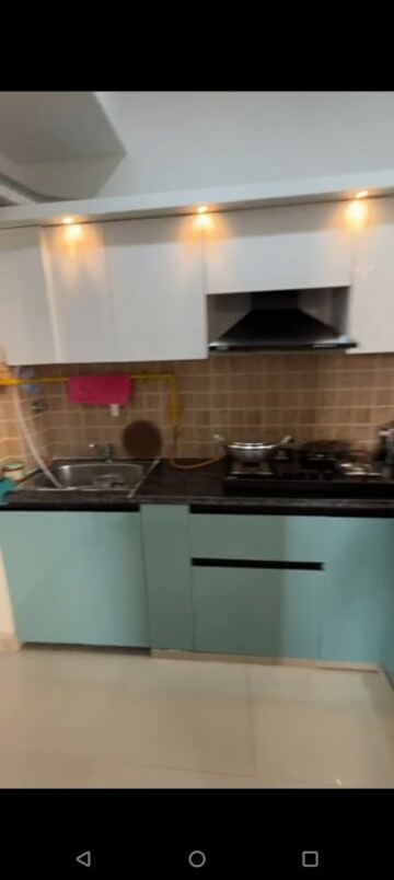 Kitchen in 2 BHK Apartment at Mahagun Mywoods, Sector 16c Greater Noida – for Rent