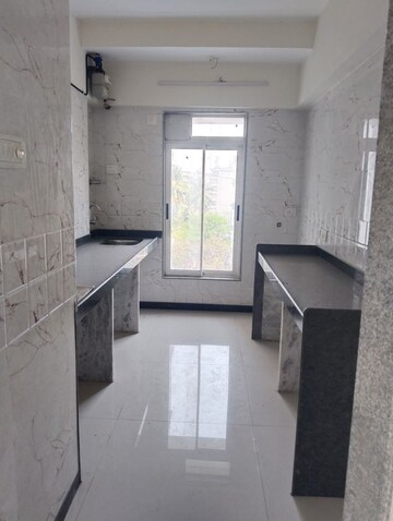 Kitchen in 1 BHK Apartment at Ani Anu Sri Balaji Enclave, Malad West – for Sale