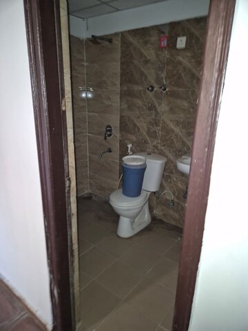 Bathroom in 2 BHK Apartment at Aims Golf City, Sector 75 – for Sale