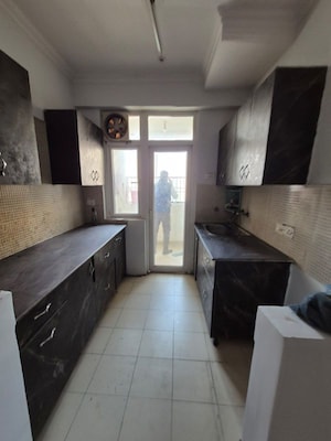 Kitchen in 2.5 BHK Apartment at Aims Golf City, Sector 75 – for Sale