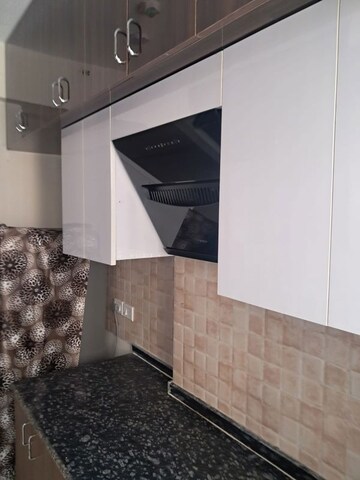 Kitchen in 3 BHK Apartment at Amrapali Heartbeat City, Sector 107 – for Rent