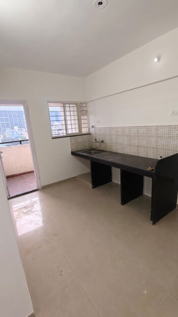 Kitchen in 2 BHK Apartment at Jalan Aura County Pune, Wagholi – for Rent