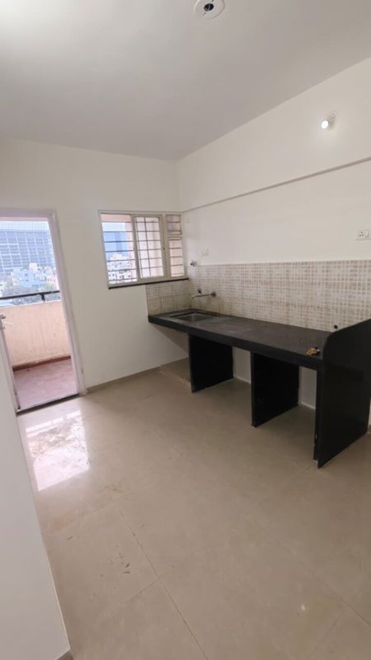 Kitchen, jalan-aura-county-pune 2 Bedroom 1078 Sq.Ft. Apartment In Wagholi Pune 10008690