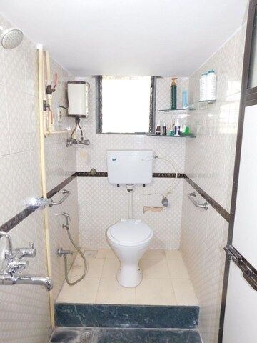 Bathroom in 3 BHK Apartment at Julias Wadi CHS, Goregaon East – for Rent