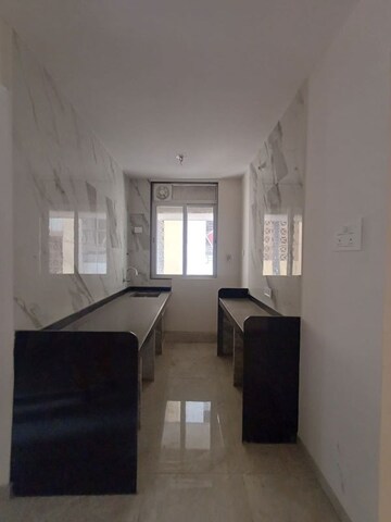 Kitchen in 1 BHK Apartment at Naupada – for Sale