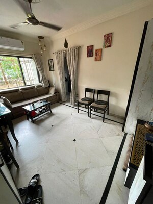 Living Room in 1 BHK Apartment at Akanksha CHS, Malad West – for Sale
