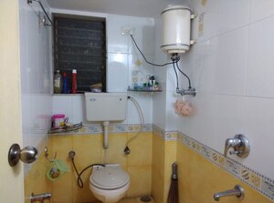 Bathroom in 1 BHK Apartment at Ahimsa Appa CHS, Malad West – for Sale