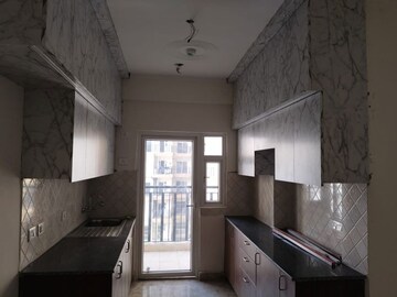 Kitchen in 2 BHK Apartment at Amrapali Dream Valley, Tech Zone 4 Greater Noida – for Sale
