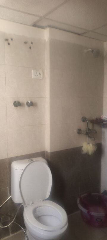 Bathroom in 3.5 BHK Apartment at Aims Golf City, Sector 75 – for Rent