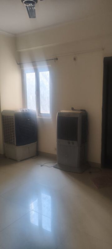 Living Room in 3.5 BHK Apartment at Aims Golf City, Sector 75 – for Rent