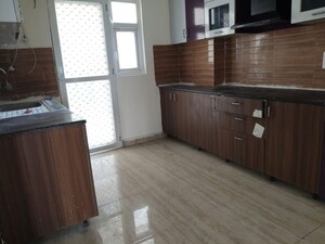 Kitchen in 3 BHK Apartment at Amrapali Dream Valley, Tech Zone 4 Greater Noida – for Sale