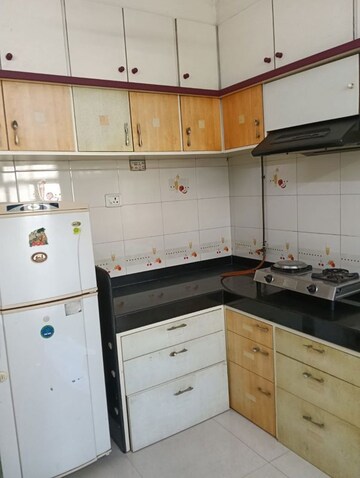 Kitchen in 2 BHK Apartment at Shri Ganesh Aangan CHS, Kandivali East – for Rent