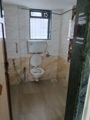 Bathroom in 2 BHK Apartment at Shri Ganesh Aangan CHS, Kandivali East – for Rent