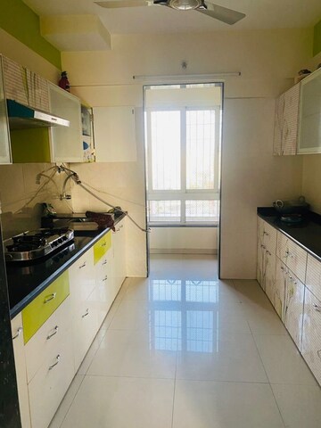 Kitchen in 3 BHK Apartment at Puranik Rumah Bali, Ghodbunder Road – for Rent