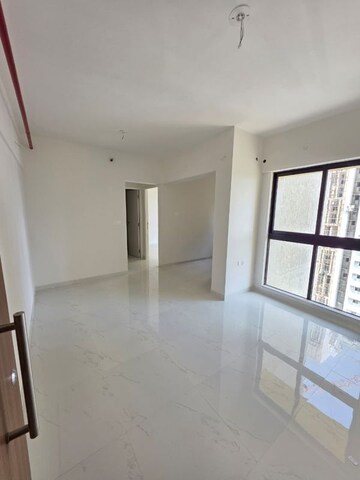 Living Room in 1 BHK Apartment at Runwal Gardens, Dombivli East – for Rent