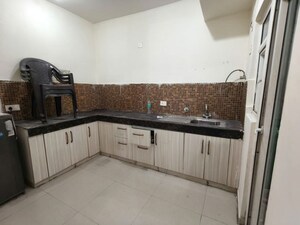 Kitchen in 2 BHK Apartment at JKG Palm Court, Sector 16c Greater Noida – for Rent