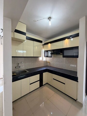 Kitchen in 2 BHK Apartment at JNC The Park, Sector 16c Greater Noida – for Rent