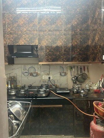 Kitchen in 2 BHK Apartment at Windsor and Nova Society, Ahinsa Khand 2 – for Sale