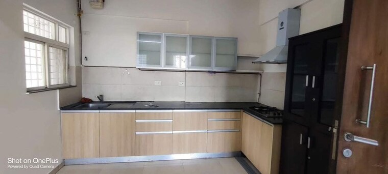 Kitchen, gera-song-of-joy 2 Bedroom 1230 Sq.Ft. Apartment In Kharadi Pune 10012190