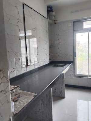 Kitchen in 2 BHK Apartment at Ani Anu Sri Balaji Enclave, Malad West – for Sale