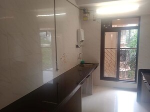 Kitchen in 2 BHK Apartment at Ani Anu Sri Balaji Enclave, Malad West – for Sale