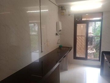 Kitchen in 2 BHK Apartment at Ani Anu Sri Balaji Enclave, Malad West – for Sale