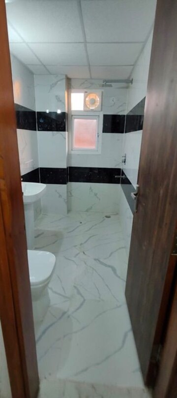 Bathroom in 4 BHK Apartment at Uninav Eden, Raj Nagar Extension – for Rent