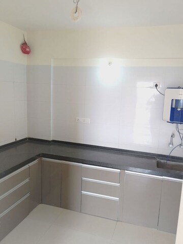 Kitchen in 2 BHK Apartment at Goodwill Nirmiti, Lohgaon – for Rent