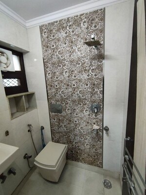 Bathroom in 3 BHK Apartment at Rohini Sector 13 – for Sale