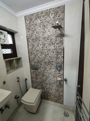 Bathroom in 3 BHK Apartment at Rohini Sector 13 – for Sale
