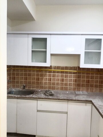 Kitchen in 2.5 BHK Apartment at Mahagun Mywoods II, Sector 16c Greater Noida – for Rent