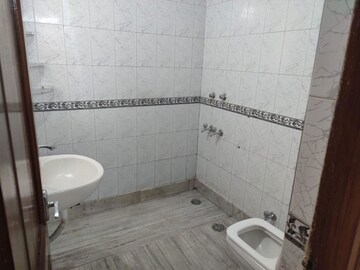 Bathroom in 3 BHK Apartment at Defence Colony – for Rent