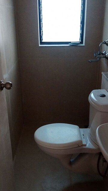 Bathroom in 2 BHK Apartment at Runwal Gardens, Dombivli East – for Rent