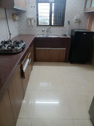 Kitchen in 2 BHK Apartment at Jasmine Tower, Vasant Vihar – for Sale