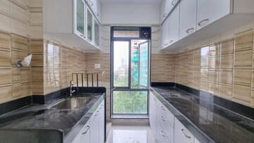 Kitchen in 2 BHK Apartment at Om New Aashirwad CHS, Malad West – for Sale