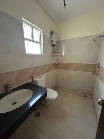 Bathroom in 2.5 BHK Builder Floor at Wave Floors, Mahurali – for Rent
