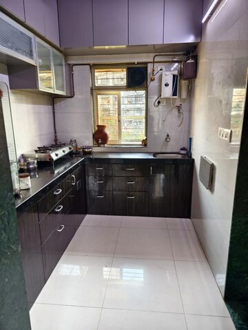 Kitchen in 2.5 BHK Apartment at Neema Sharda Heights, Andheri East – for Sale