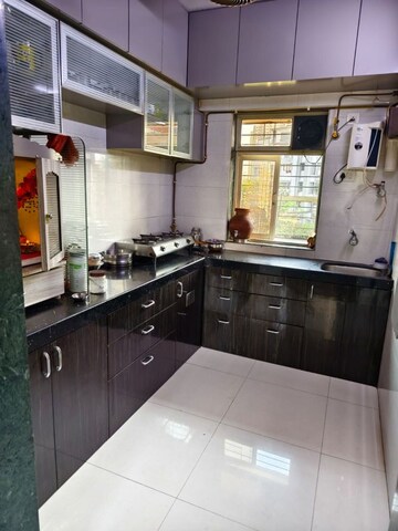 Kitchen in 2.5 BHK Apartment at Neema Sharda Heights, Andheri East – for Sale