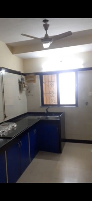 Kitchen in 2 BHK Apartment at Serenity Heights, Malad West – for Rent