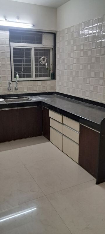 Kitchen in 2 BHK Apartment at Shri Sainath Sentosa Pearl, Wakad – for Rent
