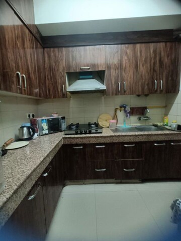 Kitchen in 2 BHK Apartment at Logix Blossom Greens, Sector 143 – for Rent