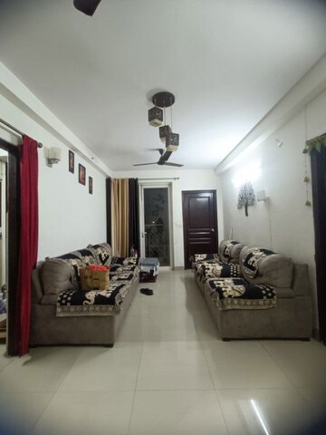 Living Room in 2 BHK Apartment at Logix Blossom Greens, Sector 143 – for Rent
