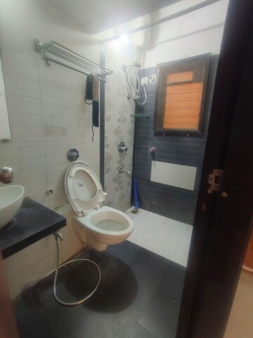 Bathroom in 1 BHK Apartment at Parijat Gardens Marigold CHS, Kasarvadavali – for Rent