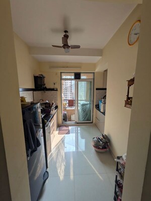 Kitchen in 1 BHK Apartment at Parijat Gardens Marigold CHS, Kasarvadavali – for Rent
