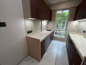 Kitchen in 2 BHK Apartment at Perna Perm Milan CHS, Mahim – for Sale