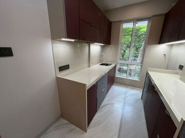 Kitchen in 2 BHK Apartment at Perna Perm Milan CHS, Mahim – for Sale